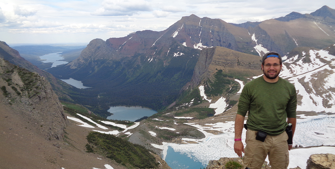 Brendan Pinto on top of a freaking mountain